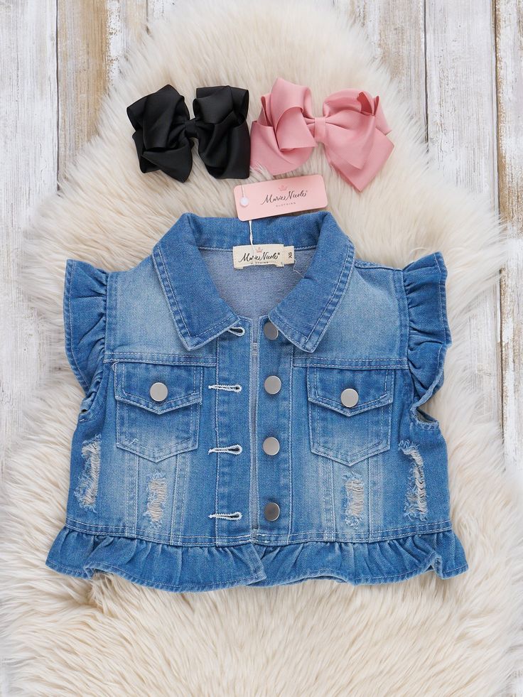 This adorable denim vest is the perfect layering piece for your little one’s wardrobe. Featuring cute ruffle sleeves and stylish frayed hem detailing, this vest adds a trendy touch to any outfit. With its button-front design, it’s easy to wear and pairs beautifully with dresses, skirts, or leggings. Fits true to size. 84.2% Cotton / 10.3% Viscose / 5.5% Polyester Suggest Bow Color: #5 & #57 Import. *Afterpay and Sezzle Purchase Requires $35 Minimum Order. Ruffle Sleeves, Front Design, Denim Vest, Layering Pieces, Blue Denim, Layering, Girl Outfits, Dresses Skirts, Leggings