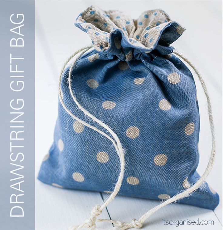 a blue bag with white polka dots on it