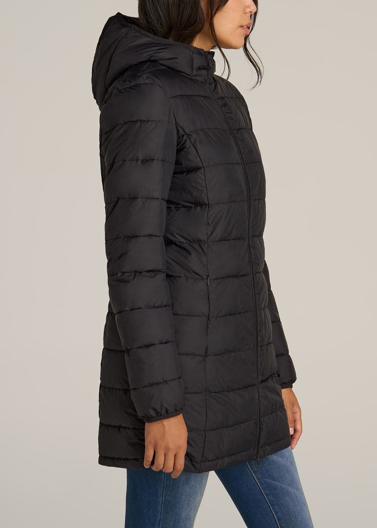 About Our Packable Mid Length Puffer Tall Women's Jacket When you want versatility in an outer layer, our packable puffer jacket for tall women is the perfect option. It features a below-the-hip length and extra-long sleeves tailored for your frame. This lightweight jacket features a water-resistant shell and light poly fill, perfect for three-season wear, while elastic cuffs and a storm hood help to block out wind. We made this tall women's jacket for travel, commutes and outdoor walks. It pack Stretch Nylon Outerwear For Cold Weather, Cold Weather Stretch Nylon Outerwear, Casual Puffer Jacket For Travel, Black Winter Travel Puffer Jacket, Black Puffer Outerwear For Travel, Versatile Nylon Puffer Jacket For Cold Weather, Packable Winter Outerwear For Outdoor, Packable Winter Outerwear For Cold Weather, Black Fall Travel Puffer Jacket