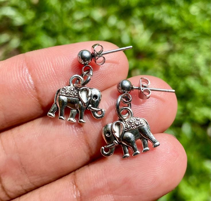 Small minimalist Elephant earrings *Made with high quality Alloy stainless steel charms with hypoallergenic stainless steel ear stud post *With proper care will last for years just store away in a jewelry box when not using and keep away from moisture *How to properly take care of your jewelry  1. Remove jewelry before showering or swimming, avoid any contact with water lotions or perfume  2. If your Jewelry starts to look dull just clean with white vinegar and fiber cloth 3. When not using keep Nickel-free Dangle Plug Earrings For Gift, Nickel-free Dangle Plug Earrings As Gift, Nickel Free Dangle Plug Earrings For Gift, Gift Stainless Steel Drop Earrings, Single Stainless Steel Plug Earring Gift, Nickel-free Metal Plug Earrings As Gift, Minimalist Metal Plug Earrings As Gift, Nickel-free Surgical Steel Plug Earrings For Gift, Minimalist Stainless Steel Earrings For Gift