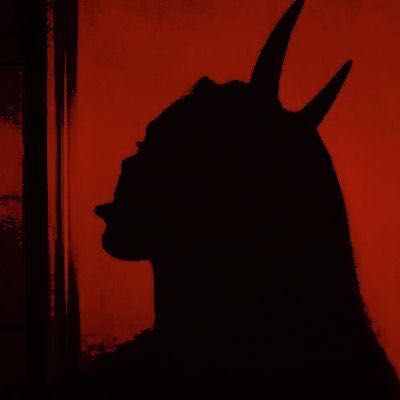 the silhouette of a man with horns on his head is shown against a red background