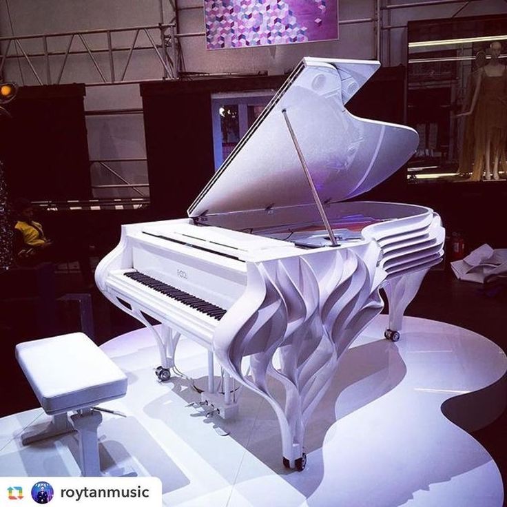 a white piano sitting on top of a table