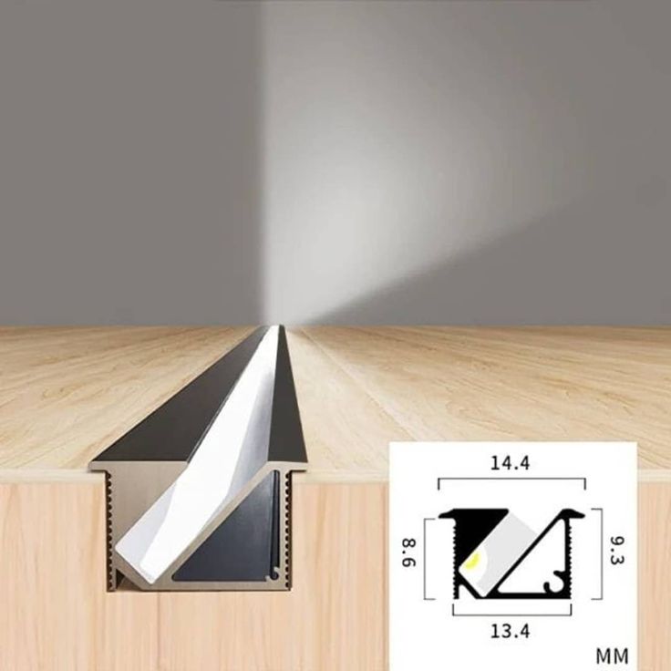 an angled view of a wooden floor with a light coming from the top and below it