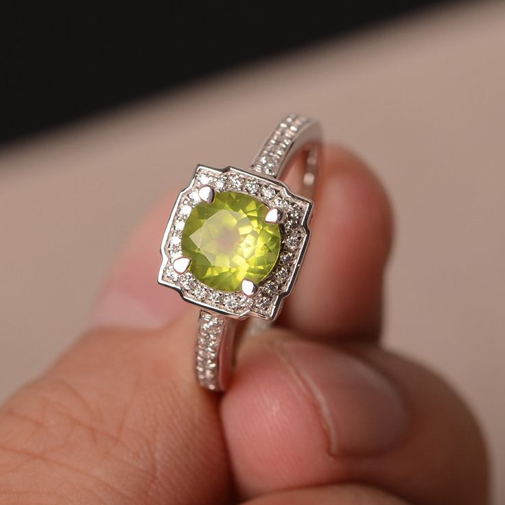 This is a gorgeous handmade creation. Its beauty is its simplicity & Elegance. The 7*7mm round cut natural peridot is crafted in solid sterling silver and with rhodium plated. It is available to customized, if you have any mind, just let me know, we will discuss with it. All item is sent in a beautiful gift box You can realize more lovely stuff clicking the link https://www.etsy.com/shop/knightjewelry?refshopsection_shophome_leftnav Please leave the correct address and you PHONE NUMBER for d Peridot Birthstone Diamond Ring Fine Jewelry, Peridot Center Stone Jewelry For May Birthstone, Peridot Ring Gemstone Gift, Peridot Gemstone Ring Gift, Elegant Peridot Crystal Ring As A Gift, Anniversary Peridot Birthstone Ring With Gemstone, Peridot Gemstones For Anniversary - May Birthstone, Lime Green Peridot Birthstone Ring For Promise, Peridot Gemstones Birthstone For Anniversary