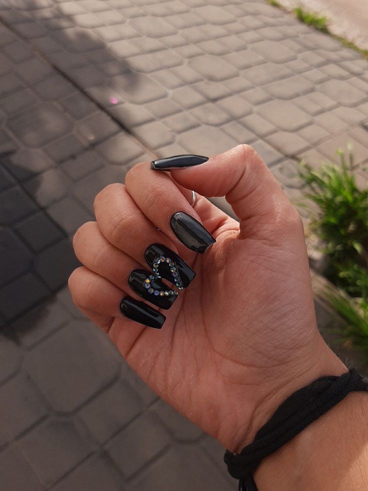 nails Black Nails With Gems Short, Goth Nails Matte, Black Nail Ideas With Rhinestones, Black Nails With Heart Rhinestones, Black Diamond Nails Rhinestones, Black Pink Heart Nails, Black With Gems Nails, Black Nails With Rhinestones Short, Nails Black With Heart