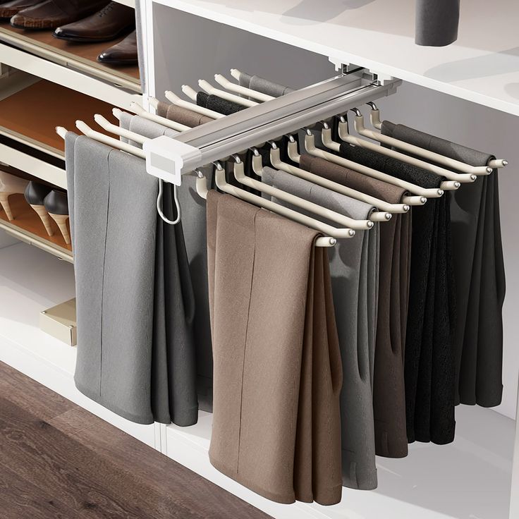 a rack with pants and shoes hanging from it