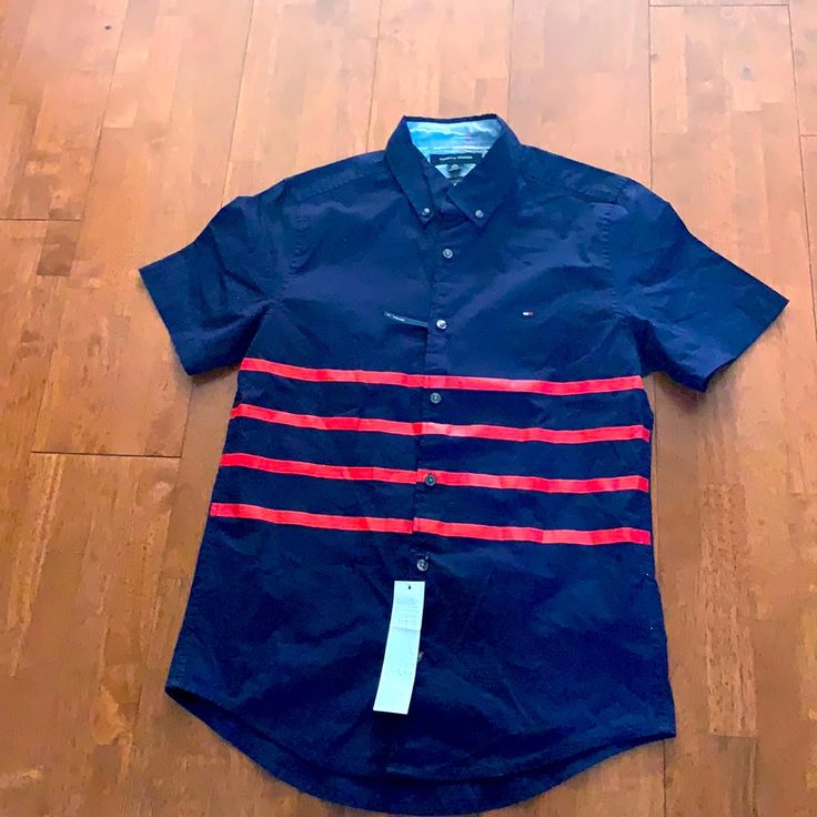 Navy Blue With Red Stripes Slim Fit Perfect Fit Anyone Ladies Even For Your Son That’s Too Small For Men’s And Too Big For Kids Fitted Casual Tommy Hilfiger Shirt, Tommy Hilfiger Fitted Casual Shirt, Fitted Blue Tommy Hilfiger Shirt, Tommy Hilfiger Red Cotton Shirt, Red Tommy Hilfiger Cotton Shirt, Tommy Hilfiger Blue Short Sleeve Shirt, Casual Tommy Hilfiger Short Sleeve Shirt, Tommy Hilfiger Cotton Short Sleeve Shirt, Tommy Hilfiger Navy Short Sleeve Top