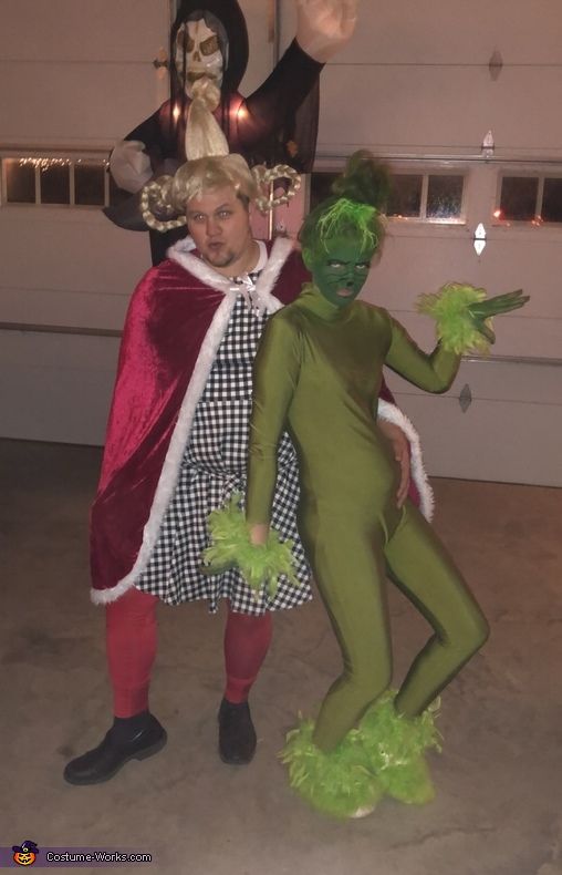 two people dressed in costumes standing next to each other