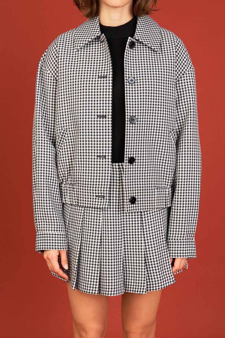 Upgrade your jacket game with our Gingham Check Jacket. This collared jacket features a trendy gingham check pattern that adds a touch of modernity to your outfit. The long sleeves with buttoned cuffs provide a tailored and polished look perfect for both casual and formal occasions. The diagonal welt pockets at the front add a functional yet stylish element to the jacket. Made with high-quality materials this jacket is designed to keep you warm and looking sharp. Don't miss out on this must-have Trendy Houndstooth Pattern Button-up Outerwear, Trendy Button-up Houndstooth Outerwear, Houndstooth Pattern Tweed Jacket For Work, Houndstooth Tweed Jacket For Work, Long Sleeve Houndstooth Tweed Jacket For Work, Long Sleeve Tweed Jacket With Houndstooth Pattern For Work, Long Sleeve Plaid Tweed Jacket, Classic Spring Tweed Jacket With Button Cuffs, Classic Tweed Jacket With Button Cuffs For Spring