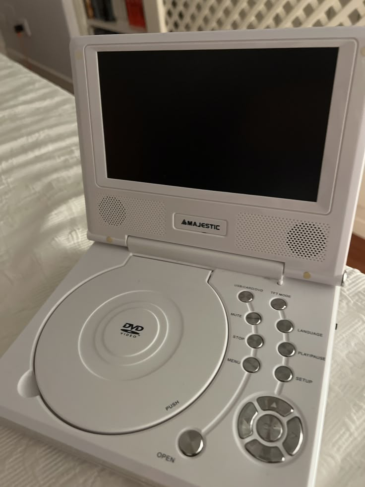 an electronic device sitting on top of a bed