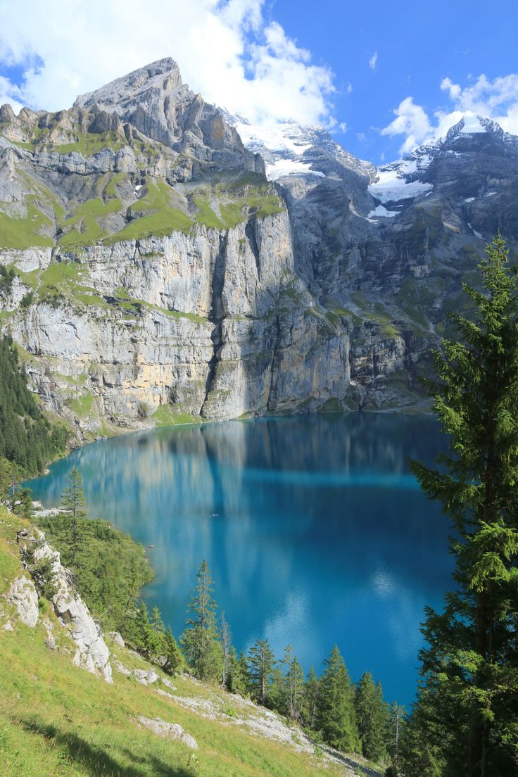 a large lake surrounded by mountains and trees