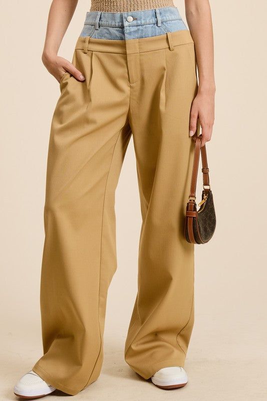 Transform your wardrobe with our Taupe Billie Trousers - the perfect combination of casual and dressy. These unique trousers feature a playful Peek-a-boo denim wash waistband and functioning front pockets. Style with a sleek top for a trendy and practical fashion statement. Each piece is one-of-a-kind due to the Denim Wash Waistband. PRE-ORDER 07/12/24 Fabric & fit:SELF: 69% POLYESTER 29% RAYON 2% SPANDEXCONTRAST: 100% COTTON Model is wearing size small. Brown Workwear Jeans With Belt Loops, Brown Jeans With Belt Loops For Work, Chic Fitted Bottoms With Patch Pockets, Chic Brown Bottoms With Five Pockets, Chic Tailored Cotton Pants, Chic Brown Spring Jeans, Chic Relaxed Fit Pants For Everyday, Chic Relaxed Fit Everyday Pants, Chic Fall Jeans With Pockets