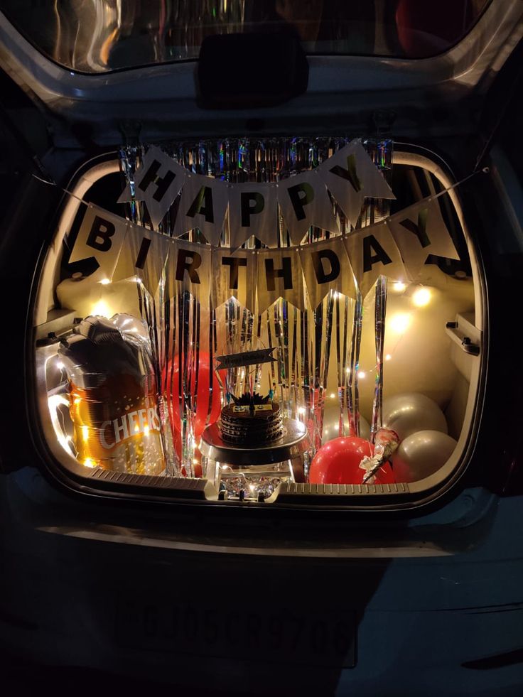 a birthday decoration in the trunk of a car