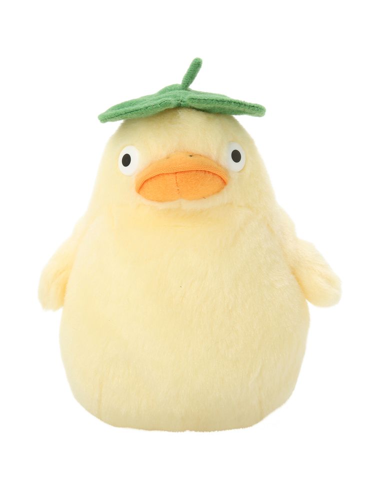 a yellow stuffed animal with a green leaf on its head