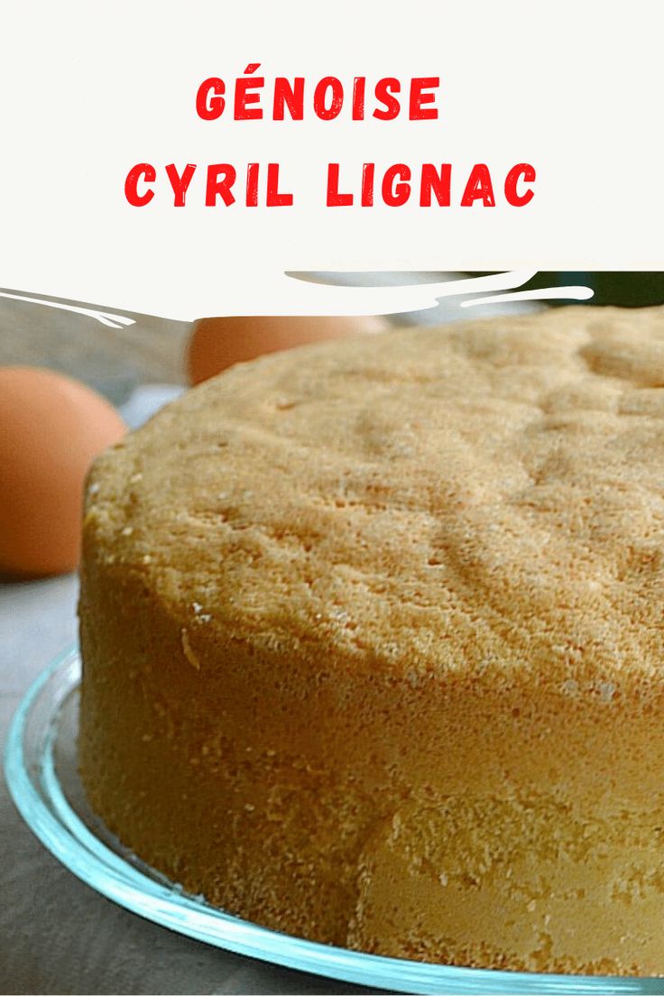 a close up of a cake on a plate with an egg in the back ground