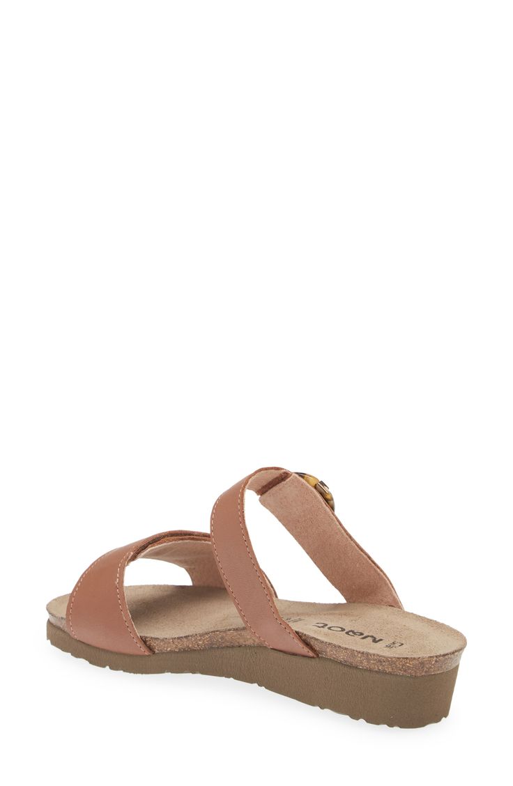 A rounded buckle stands out at the strap of a summery sandal set on a walkable wedge for everyday comfort and style. 1 1/4" heel (size 39) Adjustable hook-and-loop straps Cushioned footbed with arch support Leather upper and lining/synthetic sole Imported Casual Wedge Sandals With Buckle And Single Toe Strap, Brown Sandals For Everyday Spring Use, Everyday Toe Loop Sandals For Spring, Casual Sandals With Buckle Closure For Everyday Use, Everyday Leather Footbed Open Toe Sandals, Adjustable Open Toe T-strap Sandals For Everyday, Adjustable Double Strap Everyday Sandals, Adjustable Double Strap Sandals For Everyday, Leather Wedge Heel Sandals For Everyday