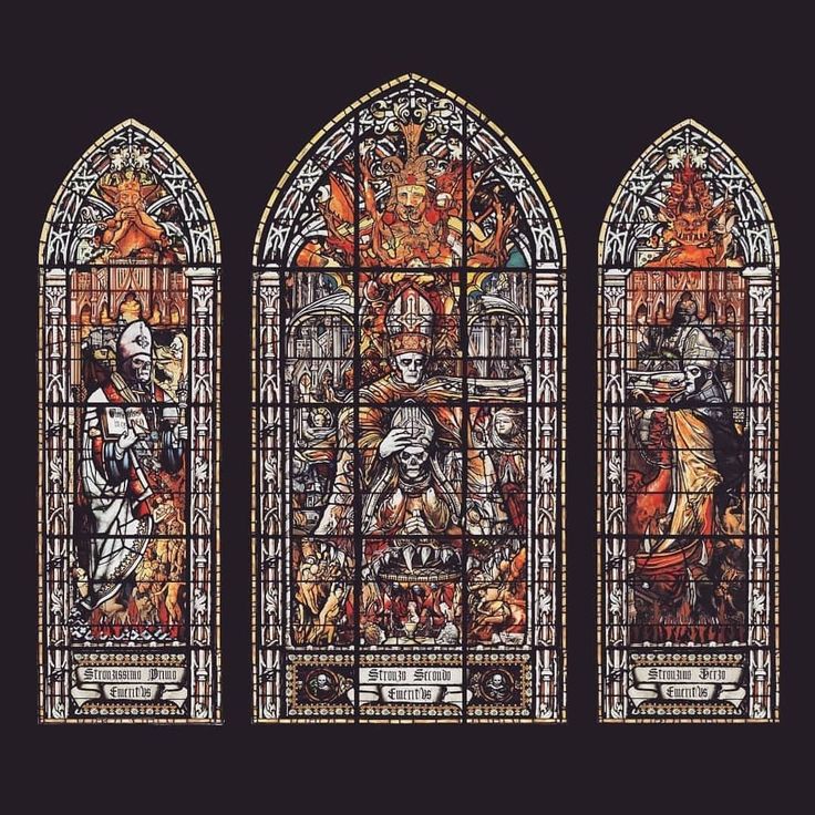 three stained glass windows with different scenes on them