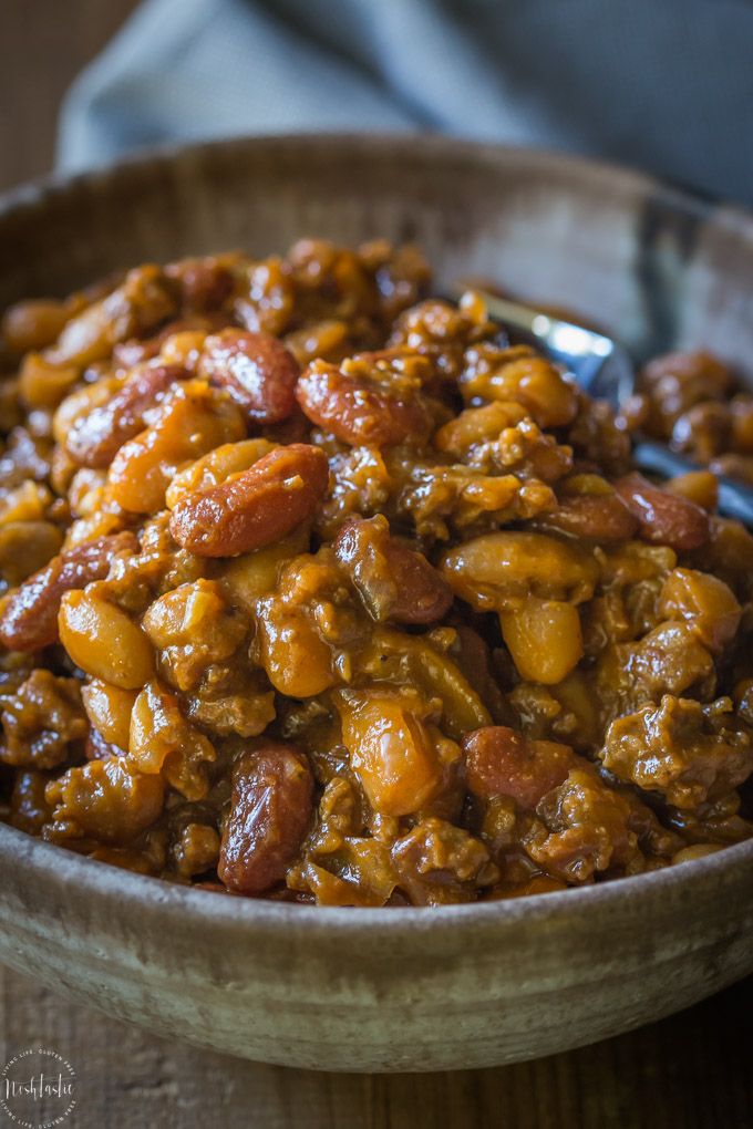 a bowl filled with chili and beans on top of a table