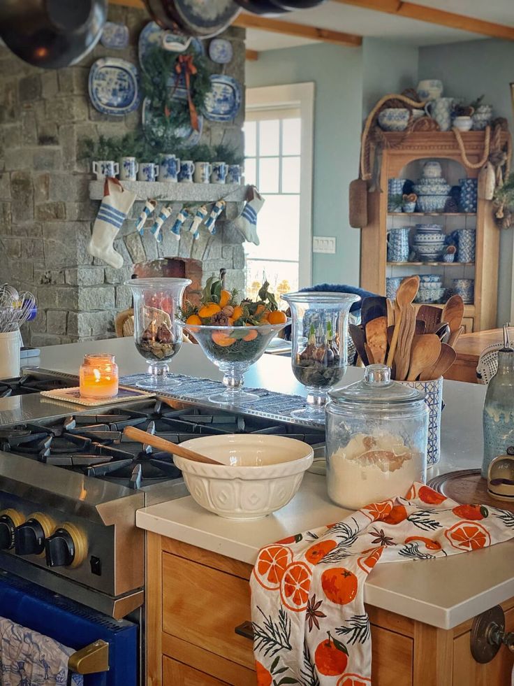 a kitchen filled with lots of clutter and cooking utensils on top of a counter