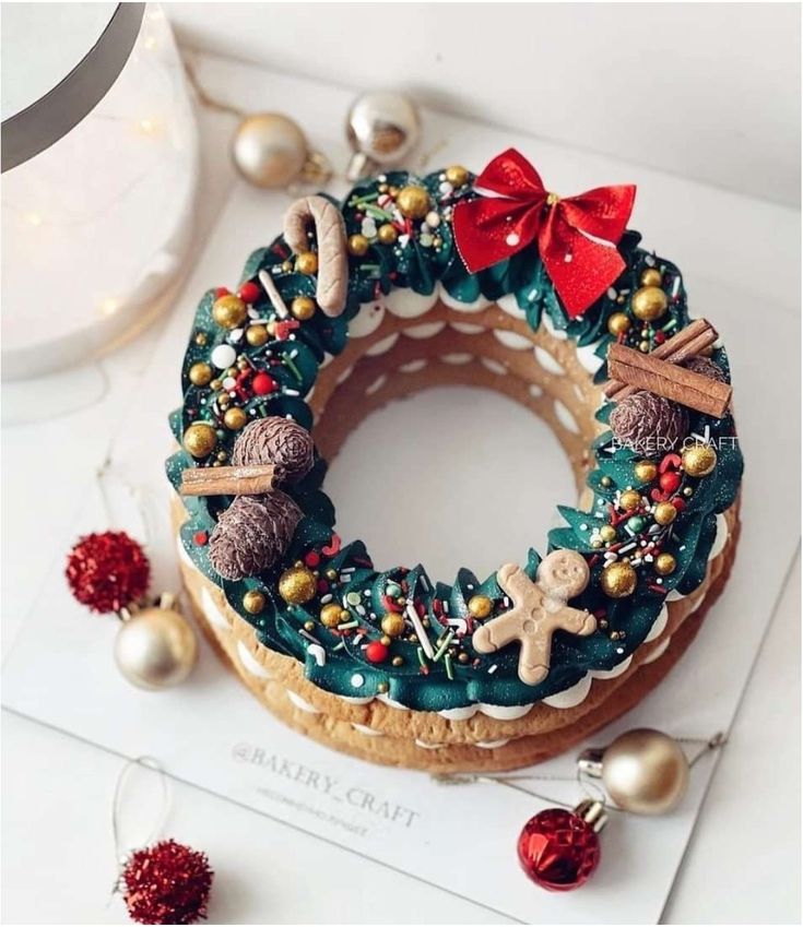 a decorated christmas wreath sitting on top of a table