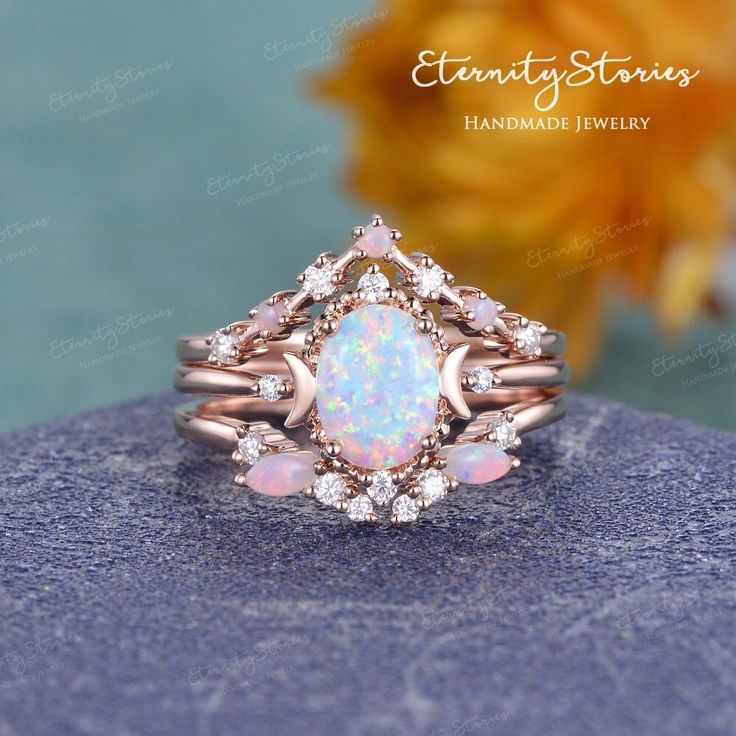 Opal Engagement Ring Set Vintage Opal Wedding Ring Set Woman Celestial Engagement Ring Bridal Set Unique Opal Ring Rose Gold Moon Ring Gift ✦Item As Shown in Solid 14K rose Gold Also available in yellow gold, white gold / Solid 14K & 18K ✧✧Jewelry details✧✧ ✦ Center stone:  Lab White Opal with Fire - Measures:  6*8mm, Oval Cut ✦ Side stones: Natural Opal, - Measures: 4*2mm Marquise Cut, 1.7mm Round Cut ✦ Side stones: 0.23ct Colorless Moissanite / Natural Diamond (H, SI) (select the accents type Opal Wedding Ring Set, Rose Gold Engagement Ring Set, Moonstone Engagement Ring Set, Opal Engagement Ring Set, Wedding Ring Sets Unique, Deco Rose, Pearl Engagement Ring, Opal Wedding Rings, Moonstone Engagement