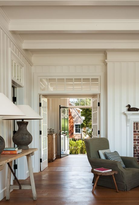 a living room filled with furniture and a fire place