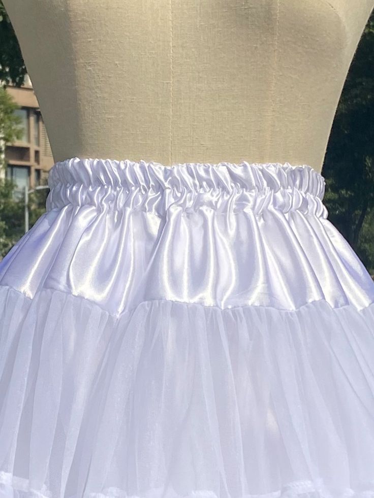 Get the ultimate Lolita look with this White/Black 35cm Puffy Cloud Petticoat! Elevate your kawaii style with this voluminous petticoat that adds the perfect amount of fluff and bounce to your outfit. Whether you're a fan of sweet Lolita or classic Lolita fashion, this petticoat is a must-have for creating that iconic silhouette. The 35cm length provides just the right amount of lift, making it ideal for pairing with a variety of Lolita dresses and skirts. Embrace the whimsical charm of Lolita f Summer Costume Petticoat With Attached Cancan, Spring Costume Petticoat With Attached Cancan, White Skirt With Attached Cancan For Costume Party, White Cancan Petticoat For Costume Party, White Costume Skirt With Attached Cancan, Voluminous Skirted Petticoat With Ruffles, White Ruffled Skirted Petticoat, White Ruffled Voluminous Petticoat, White Voluminous Ruffled Petticoat