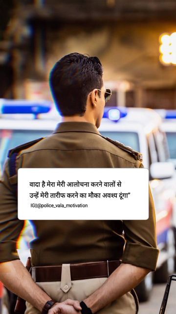 a man in uniform standing on the street with his back turned to the camera and looking at an ambulance behind him