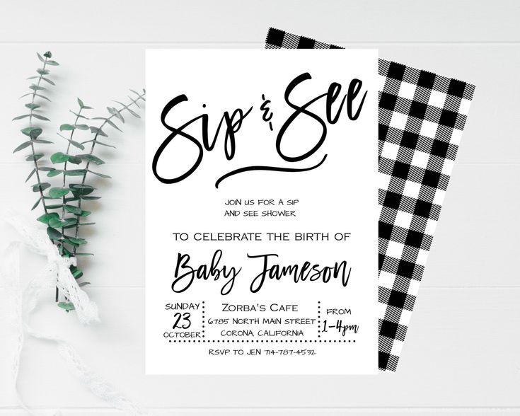 a black and white wedding card with the words he or she written on it, next to some greenery