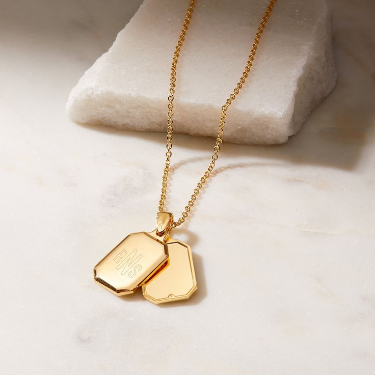 The classic locket gets a modern twist with the stylish new shape and design of our Willow Locket. Personalize the locket with your initials or monogram in your choice of engraving styles on the front of the sliding pendants to create an intimate and beautiful piece to wear or give. Available in 14K gold plated brass Two sliding pendants measure 1/2" by 1" each 17" cable chain with 2" extender Lobster claw closure With engraving this item is FINAL SALE SKU: BYN1208 Cable Chain Necklace, Christmas Favorites, Monogram Initials, Layered Look, Beautiful Packaging, Custom Engraving, Cable Chain, Lobster Claw, Locket