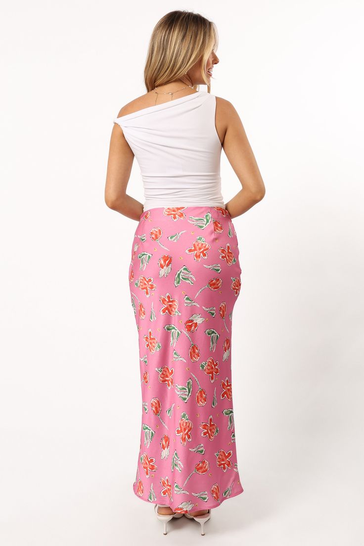 DETAILS   This midi length skirt is the perfect addition to your wardrobe. The slip style with invisible side zip ensures a comfortable fit, while the floral print detail gives it an extra touch of fun.    slip style skirt    midi length   invisible side zip  floral print design  soft satin feel   lined     material - 100% polyester     SIZING     model is 5' 5" and wears a Size XS    model stats: bust - 31.5", waist - 25.5", hips - 37"         GARMENT CARE    cold hand wash separately Rayon Midi Skirt With Floral Print, Floral Print Rayon Midi Skirt, Spring Midi Skirt With Side Slits, Spring Skirt With Side Slits For Day Out, Spring Day Out Skirt With Side Slits, Floral Print Midi Maxi Skirt For Brunch, Chic Asymmetrical Floral Print Maxi Skirt, Spring Flowy Skirt With Side Slits, Chic Asymmetrical Floral Maxi Skirt