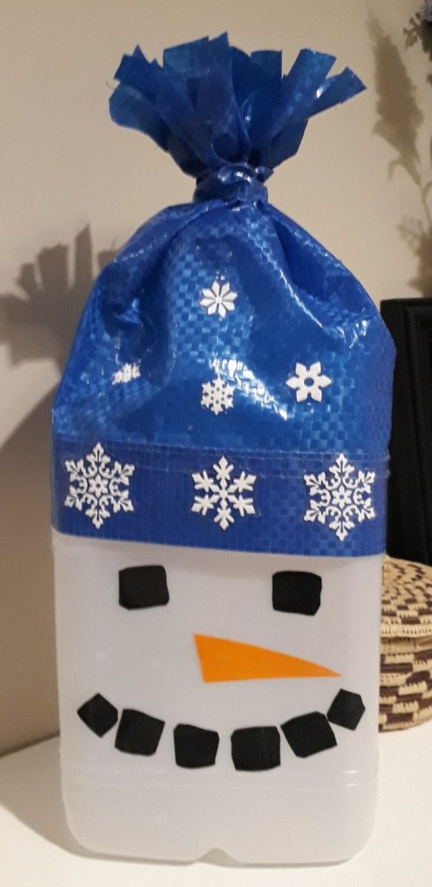 a plastic bag with a snowman face on it sitting on top of a table