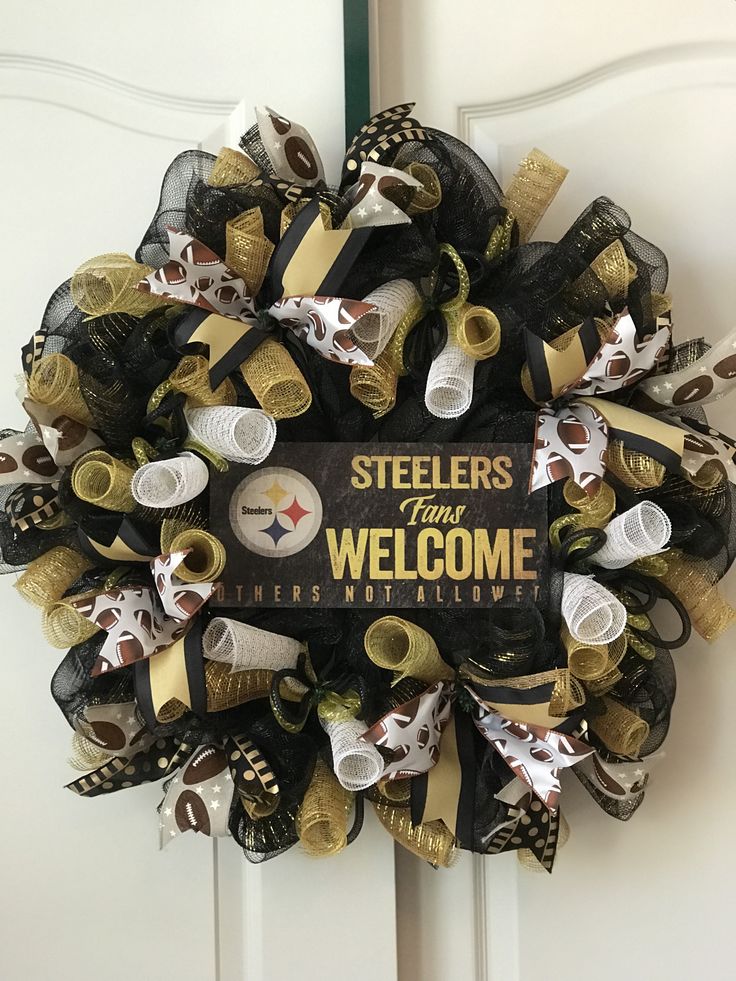 a football wreath that is hanging on the front door to welcome people into the nfl team