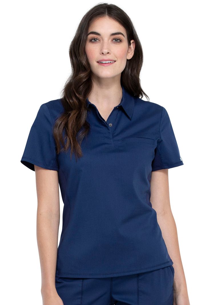 This Modern Classic fit, collared polo shirt features a three snap closure inside hidden front placket and one chest welt pocket. Contrast mesh side and under sleeve panels adds breathability and ease of movement. Side vents complete the look. This style looks great tucked in or untucked. Center back length: 24" Details: Collection : WW Revolution Fit : Modern Classic Number of Pockets : 1 Pocket Types of Pockets : Chest Pocket Features : Knit Details, Side vents, Tuckable top, Mesh Details Manufactured In : Imported Women Scrubs, Fit Scrubs, Cherokee Woman, Polo Top, Style Looks, Samoa, Zambia, Turks And Caicos, Pitcairn Islands