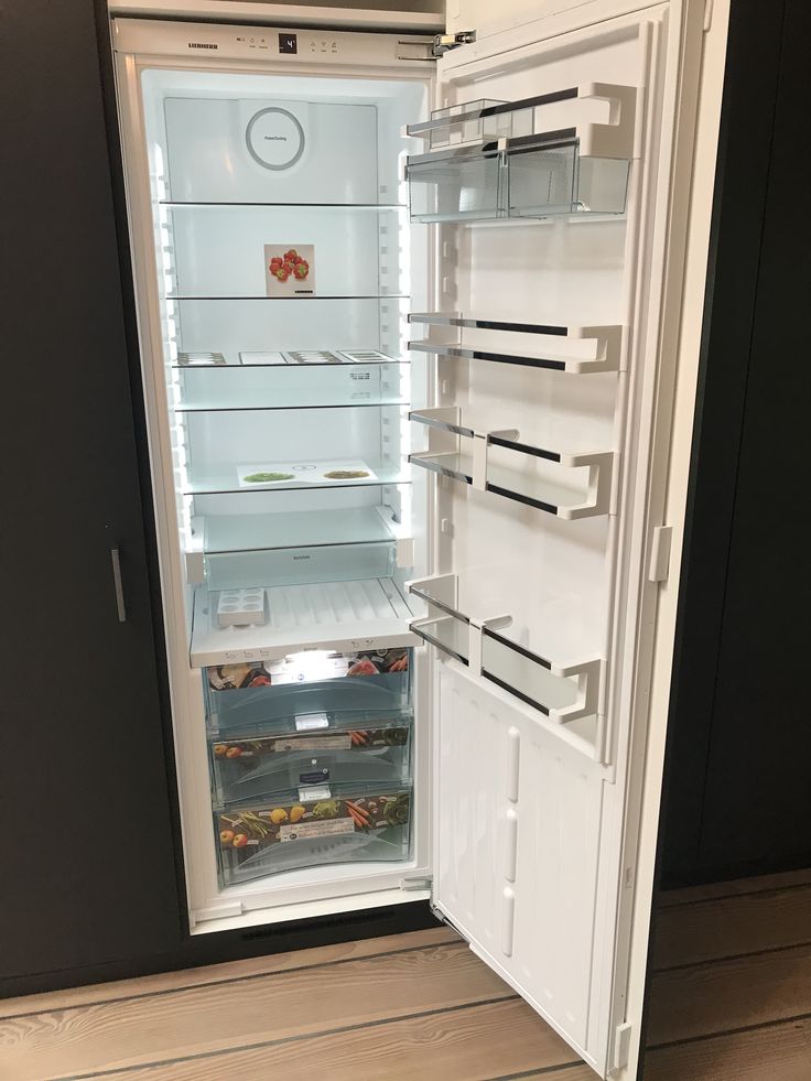 an open refrigerator with its door wide open