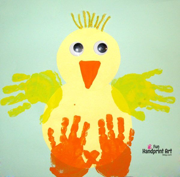 a child's handprint with a yellow bird on it and hands in the air