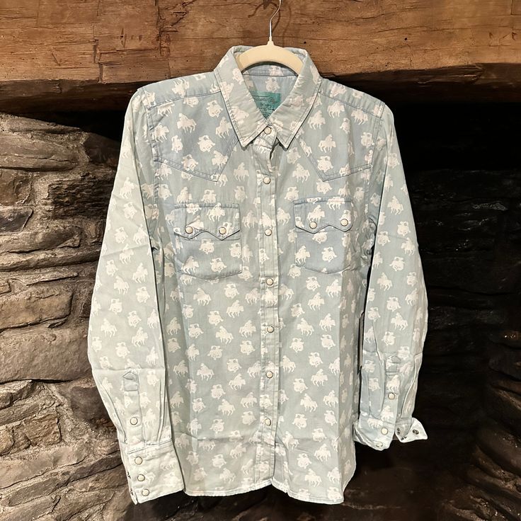 Markie Patterned Denim Shirt by Tasha Polizzi. This gorgeous shirt is a classic and timeless western style piece you will enjoy for many years to come. Wear with your favorite cowboy boots and hat to complete the look. Western Denim Shirt Women, Western-themed Graphic Print Cotton Tops, Western Button-up Tops With Pockets, Embroidered Button-up Western Tops, Denim Blue Western Button-up Tops, Tasha Polizzi, Western Outfits, Denim Shirt, Cowboy Boots