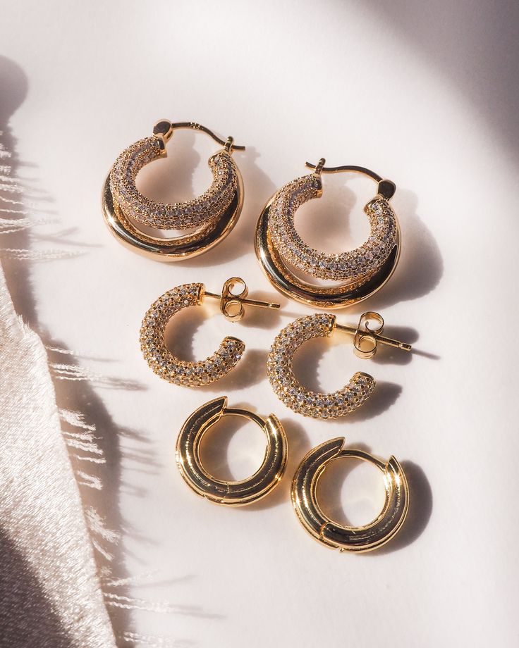 Double down on your earring game. Miles is the unexpected twist on the 14k gold plated classic hoop you didn't know you needed in your everyday earrings. Her peekaboo pave second hoop is playfully perfect and lightweight enough for daily wear. - Double tube pave hoop earrings- Hoop measures approx 22mm - 14k gold plated brass - Sterling silver post- Cubic zirconia pave accents Everyday Luxury Designer Hoop Jewelry With Pave Setting, 14k Gold Hoop Earrings With Pave Setting, 14k Gold Pave Setting Hoop Earrings, 14k Gold Pave Hoop Earrings, Small Hoop Earrings With Pave Setting Fine Jewelry, Minimalist Hoop Earrings With Pave Setting, Small Hoop Earrings With Pave Setting, Luxury Everyday Small Hoop Earrings, Luxury Small Hoop Huggie Earrings For Everyday