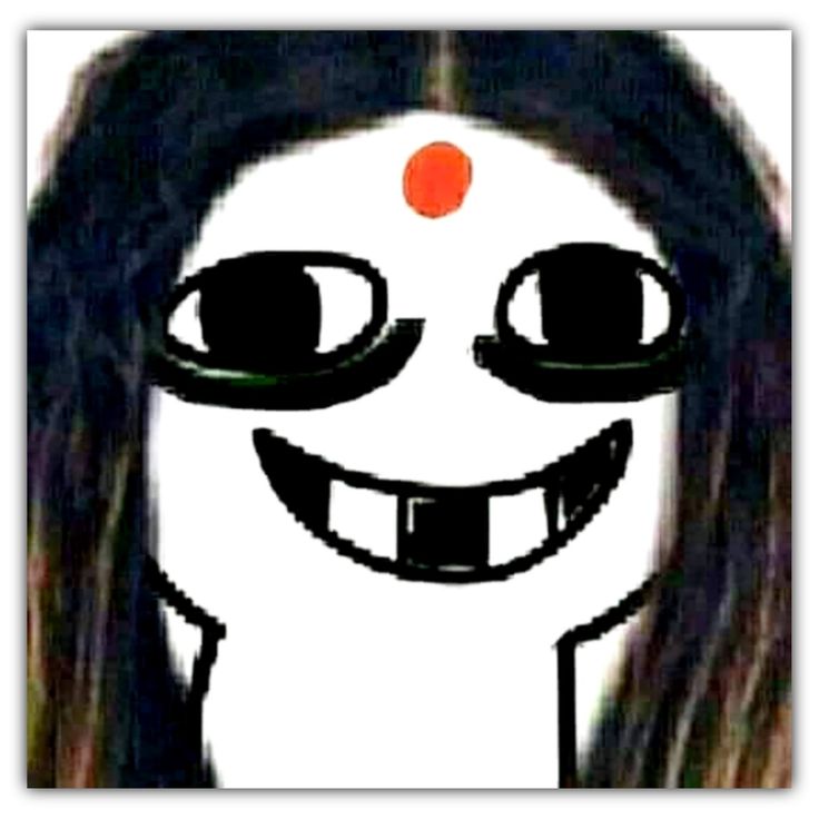 a girl with long hair and an orange dot on her forehead smiles at the camera