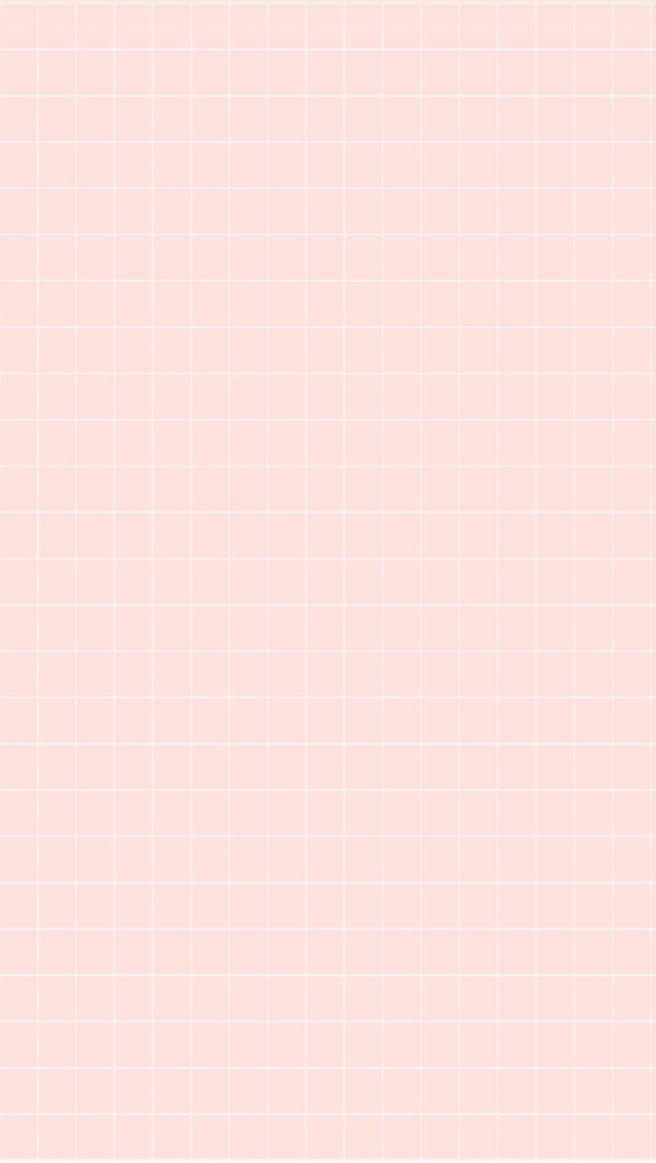 a pink tiled wall with white squares on it