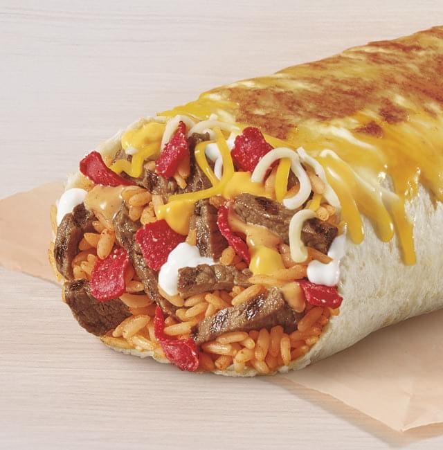 a burrito with meat, cheese and strawberries on it