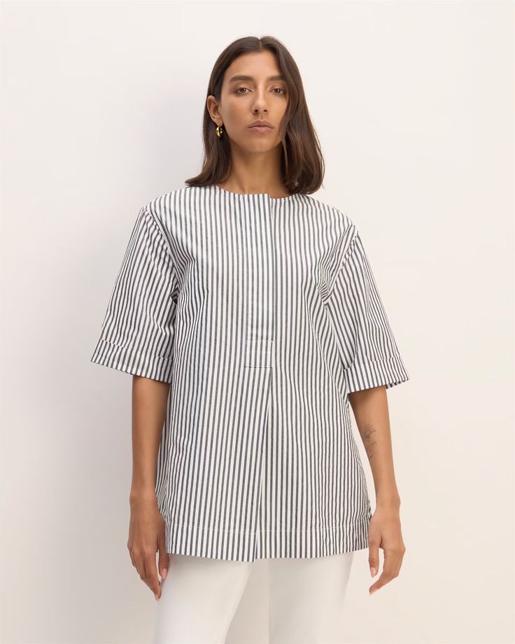 The Supima® Cotton Tunic Optic White / Black – Everlane Modern Short Sleeve Blouse For Everyday, Oversized Short Sleeve Everyday Blouse, Summer Workwear Tunic In Relaxed Fit, Relaxed Fit Summer Tunic For Workwear, Summer Workwear Tunic With Relaxed Fit, Effortless Oversized Short Sleeve Blouse, Oversized Summer Tunic For Workwear, Oversized Summer Workwear Tunic, Casual Short Sleeve Tunic For Work