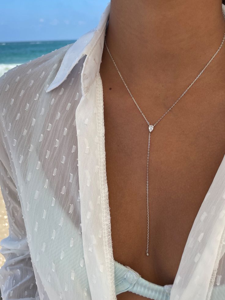 "Gorgeous Y necklace with pear main stone, made of sterling silver 925, making a simple but elegant statement. The perfect layering piece or minimalist necklace. ► FEATURES: * Sterling silver 925 necklace. Rose gold / gold are plating over sterling silver 925 ► MEASUREMENT : Chain length: 15.7\" / 40 cm Lariat length: 3.94\" / 10 cm In addition you will receive an extender chain of 5 cm \\ 2\" for you to enjoy controlling the length of your necklace. ► SHIPPING : Free worldwide shipping. All par Elegant Silver Teardrop Lariat Necklace, Dainty Teardrop Backdrop Necklace As Gift, White Gold Sterling Silver Lariat Backdrop Necklace, Teardrop Pendant Lariat Necklace With Adjustable Chain As Gift, Gift Lariat Necklace With Teardrop Pendant And Adjustable Chain, Clavicle Chain Y-shape Drop Necklace, White Gold Long Drop Necklace Gift, Silver Backdrop Necklace For Anniversary, White Gold Sterling Silver Long Drop Lariat Necklace