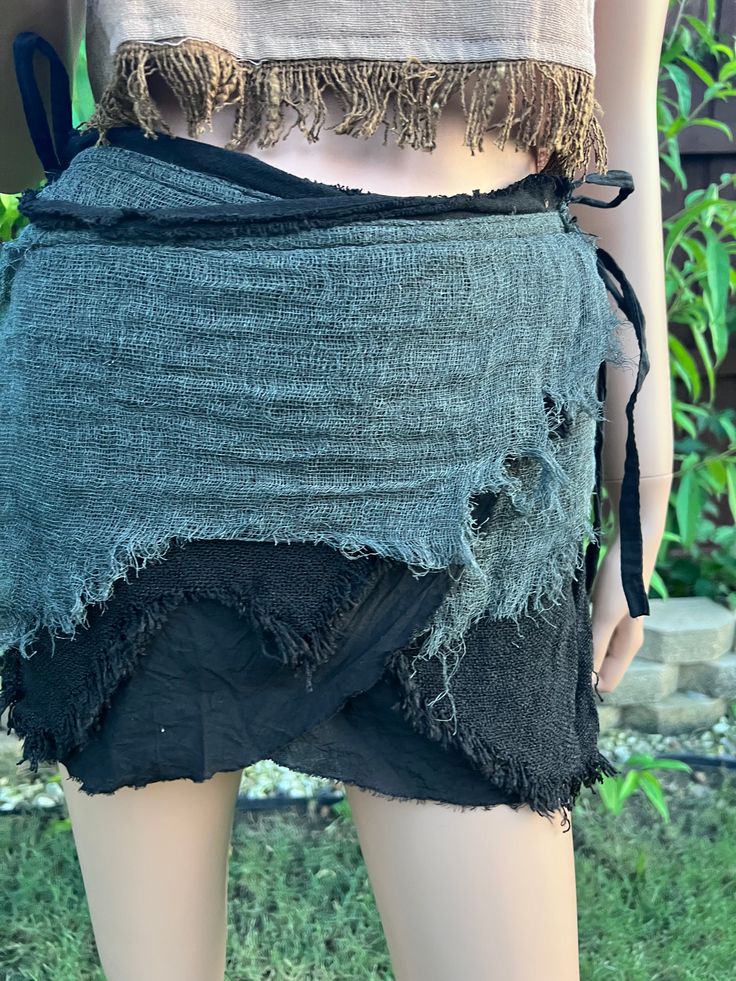 Unleash your inner pirate hippie with our black mini fringe skirt; PuzzleStack's Pirate Pixie Mini Skirt. This playful and edgy skirt features a dynamic fringe design that adds movement and flair to your every step. Perfect for festivals, parties, or casual outings, it’s made from high-quality materials for both comfort and durability. The adjustable waistband ensures a perfect fit, making it a versatile addition to any wardrobe. Embrace the magic and dance freely in this stylish pixie skirt. Tr Black Punk Mini Skirt For Festival, Punk Style Black Mini Skirt For Festival, Black Rock Mini Skirt For Festival, Black Rock Style Mini Skirt For Festival, Rock Style Black Mini Skirt For Festival, Fairy Grunge Mini Skirt For Festival, Edgy Black Mini Skirt For Festival, Hippie Style Mini Skirt For Festivals, Hippie Style Festival Mini Skirt