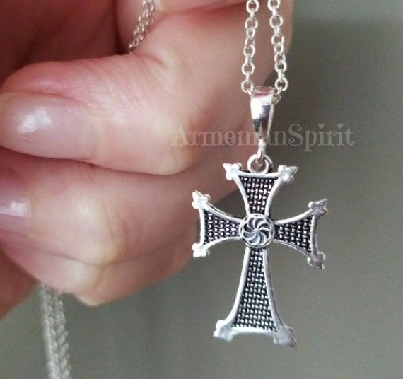 Christian cross made of sterling silver 925 with Armenian symbols of arevakhach or kerkhach which looks like a sun. The cross has a deep meaning for Armenians. Armenians were the first in the world to recognize Christianity as a state religion. Despite the fact that the cross carries Armenian symbols and meanings, it will suit all men and women who are interested in ancient symbols. The pendant cross really looks very stylish. The fact that it is made of precious metal gives it a special value a Spiritual Cross Necklace As Gift, Traditional Silver Cross Necklace, Symbolic Cross Necklace As Gift, Symbolic Cross Necklace Gift, Traditional Silver Cross Necklace As Gift, Traditional Silver Cross Necklace Gift, Silver Ankh Cross Necklace In Spiritual Style, Silver Ankh Cross Necklace Spiritual Style, Silver Ankh Cross Spiritual Necklace