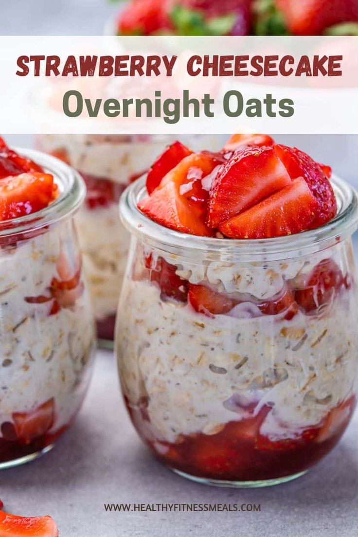 strawberry cheesecake overnight oats in mason jars with strawberries on the top and bottom