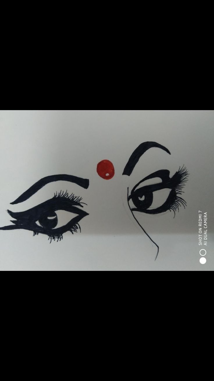 an image of a woman's face painted with black and red paint on white paper