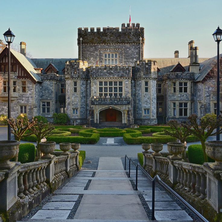 an old castle like building with a walkway leading to it