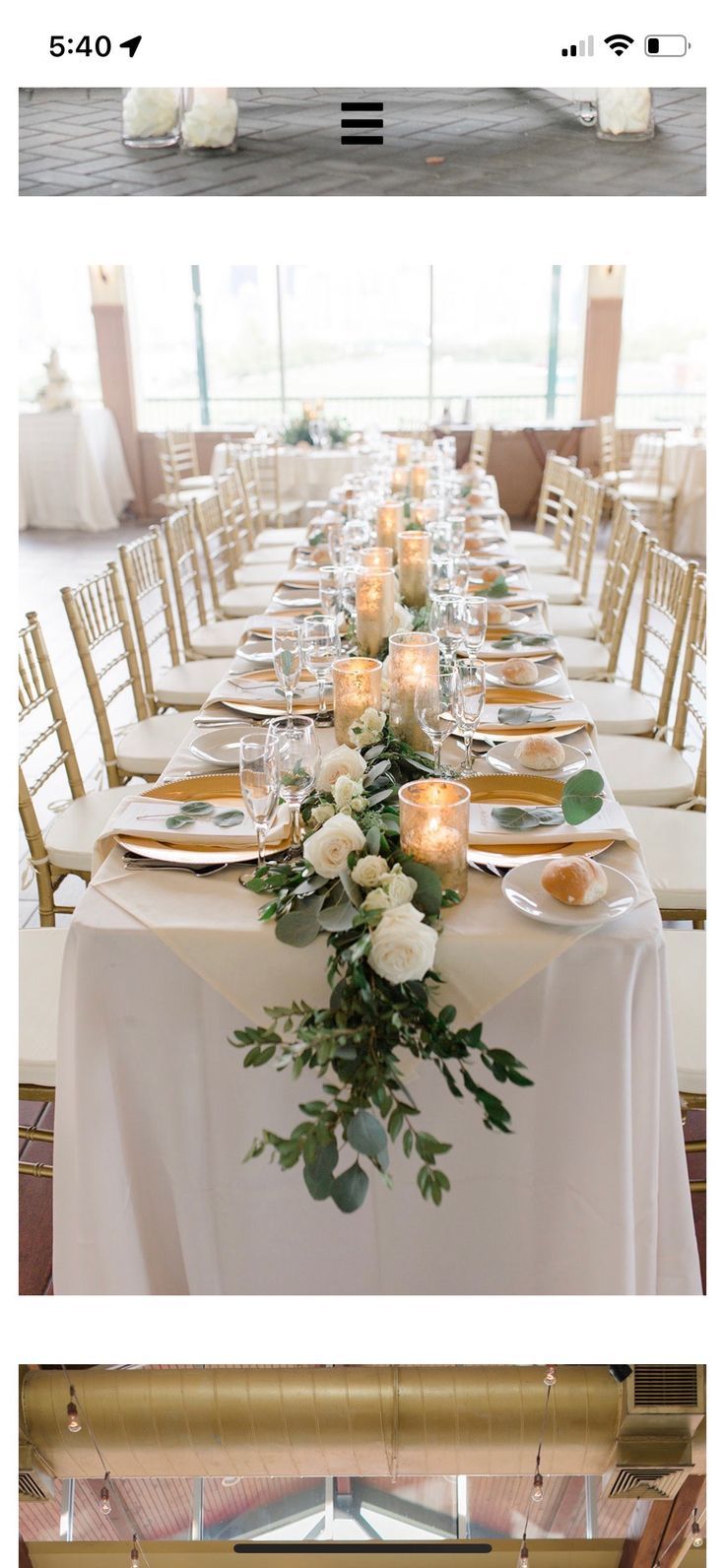 a long table is set with candles and plates