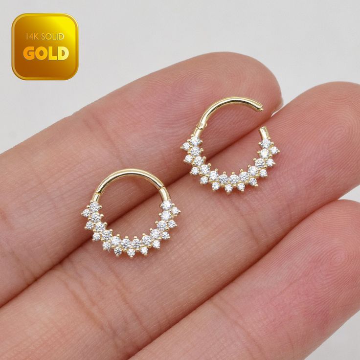 pair of gold plated cz hoop earrings with clear crystal stones in the middle